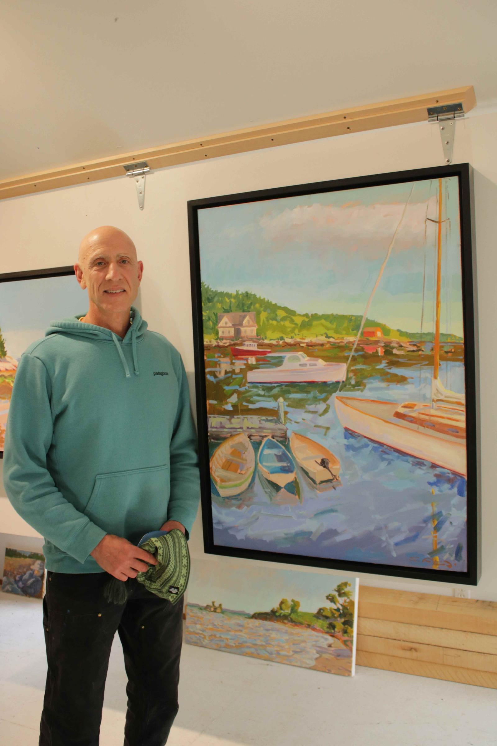 Stephen Florimi in his gallery with "Coming and Going". Photo by Mark Pillsbury